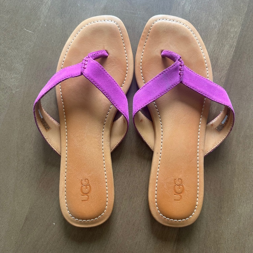 UGG sandals magenta purple straps with brown bottom.